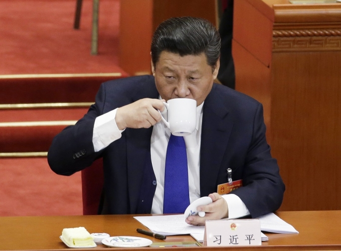 chinese-president-xi-jinping-drinks-from-a-cup-during-the-opening-of-the-annual-full-session-of-the-national-peoples-congress-at-the-great-hall-of-the-people-march-5-2015.jpg